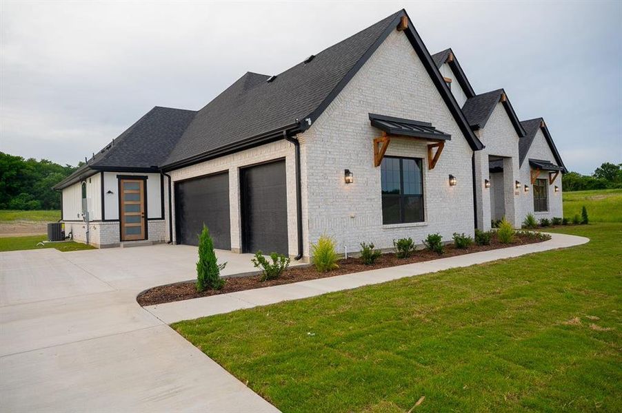 Front exterior of a new home in Capitol Hill, Anna, TX, highlighting curb appeal (Image 14). Front exterior of a new home in Capitol Hill, Anna, TX, highlighting curb appeal (Image 14).