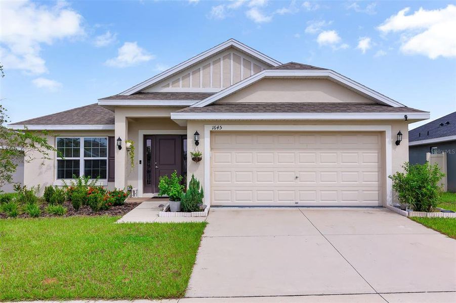 Front exterior of a new home in Citrus Landing, Davenport, FL, highlighting curb appeal (Image 18).