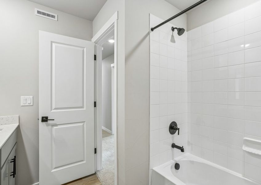 The secondary bathroom has a tub/shower combo.