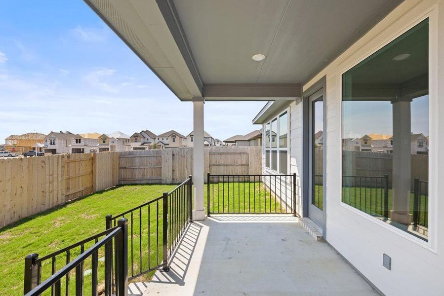 Exterior details and patio area of a home in Lariat, Liberty Hill (Image 23).