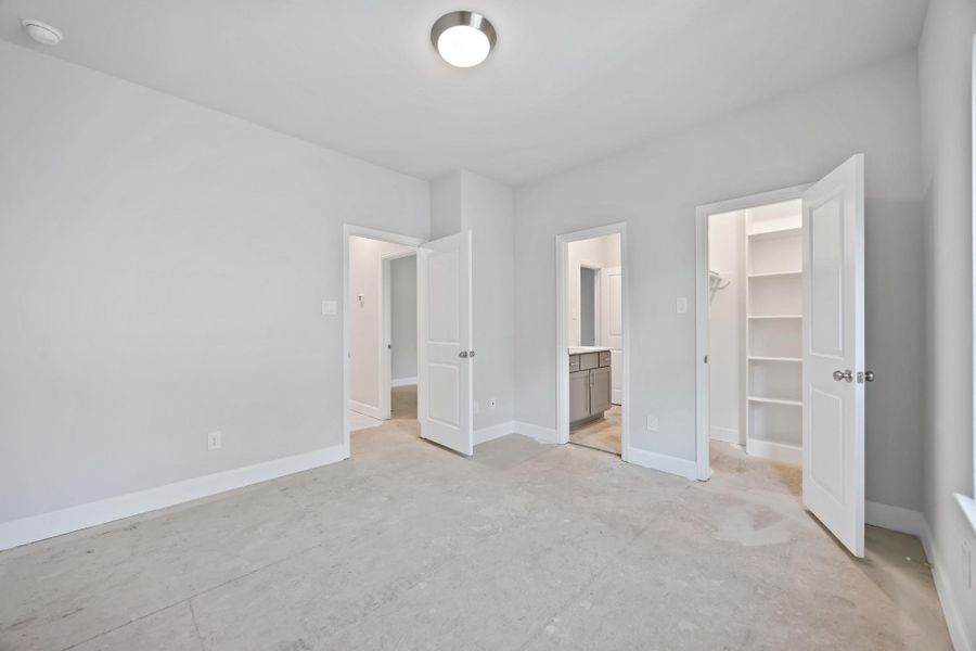 Bright, comfortable, and generously sized, this bedroom easily adapts to guests, kids, or a second home office—complete with great light and closet space.