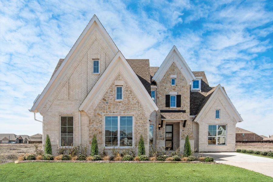 Representative exterior photo of a completed home built from the Grand Whitehall by Grand Homes in Monterra, Fate, TX (Image 21). Representative exterior photo of a completed home built from the Grand Whitehall by Grand Homes in Monterra, Fate, TX (Image 21).