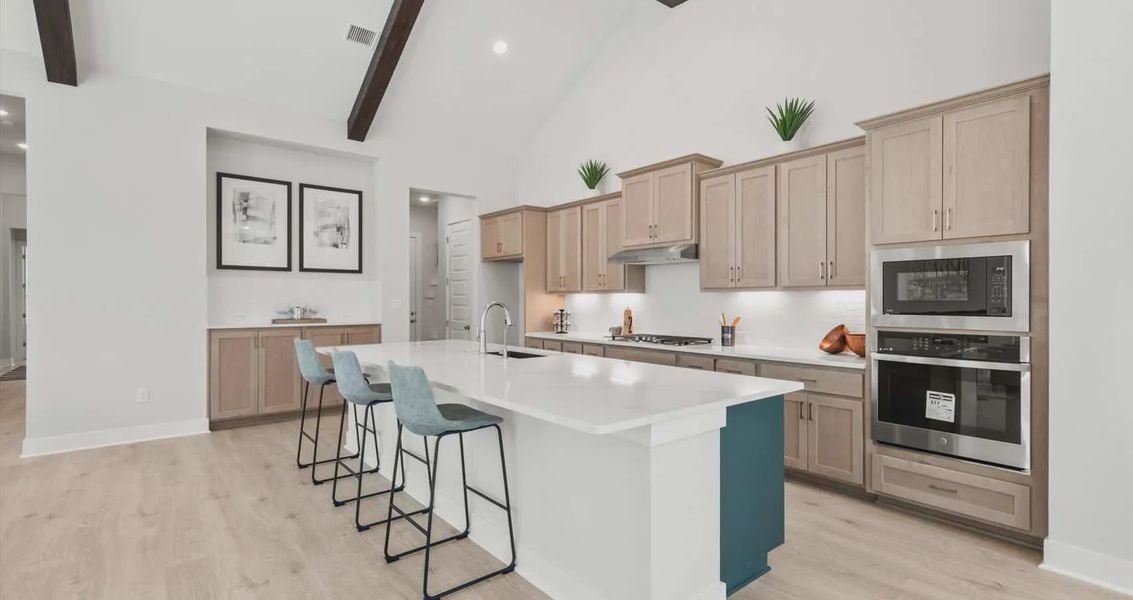 Representative furnished interior of a home built from the Draco by Chesmar Homes in The Grove at Blackhawk, Pflugerville (Image 6).