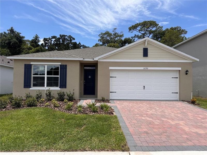 Front exterior of a new home in Sagewood, Apopka, FL, highlighting curb appeal (Image 1). Front exterior of a new home in Sagewood, Apopka, FL, highlighting curb appeal (Image 1).