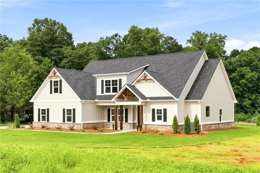 Front exterior of a new home in , Hampton, GA, highlighting curb appeal (Image 21).