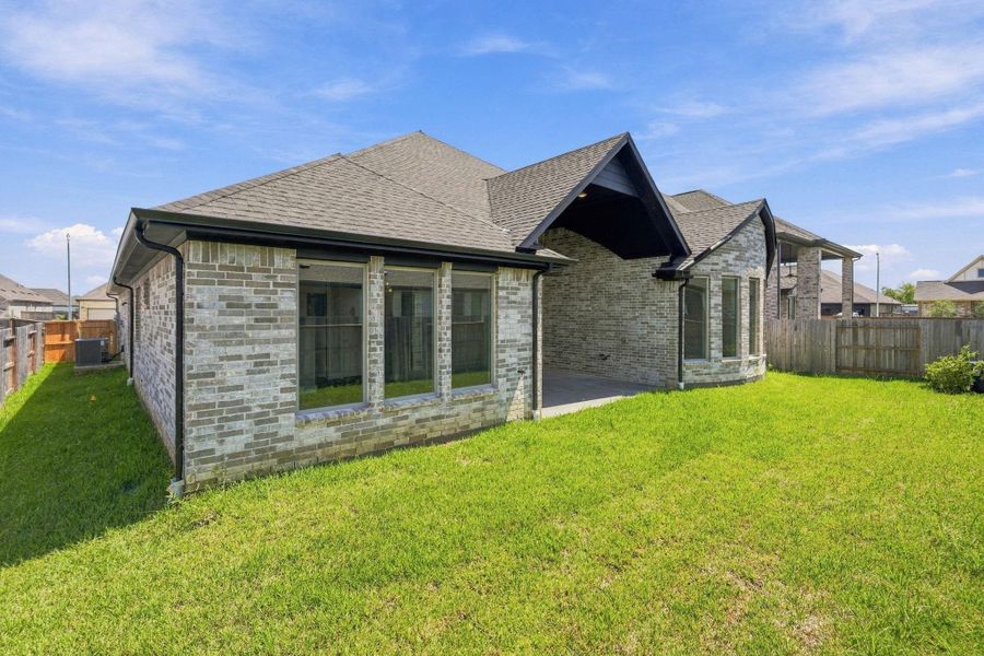 Exterior details and patio area of a home in Coastal Point, League City (Image 25).