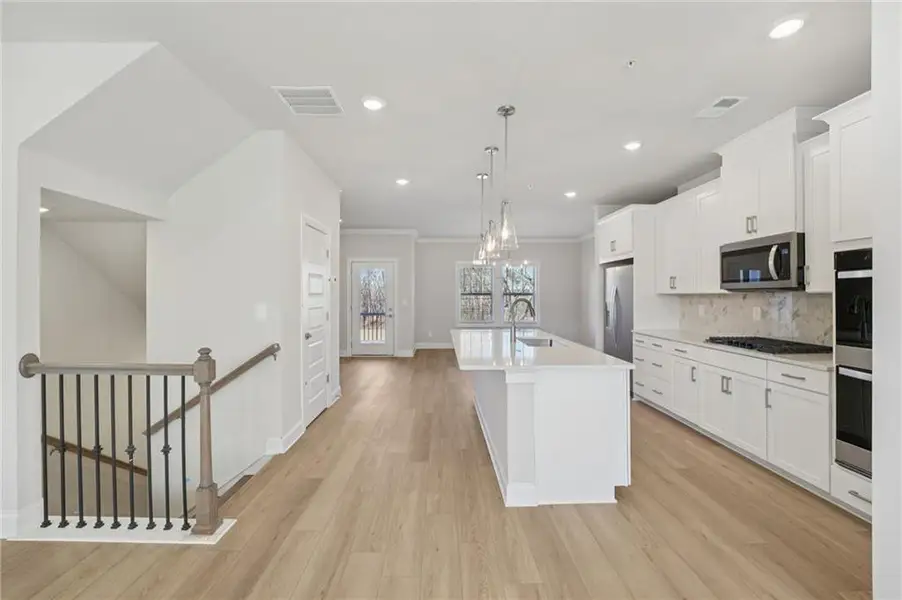 Furnished interior view inside a new home in Hemingway - Highland Series, Cumming (Image 6).