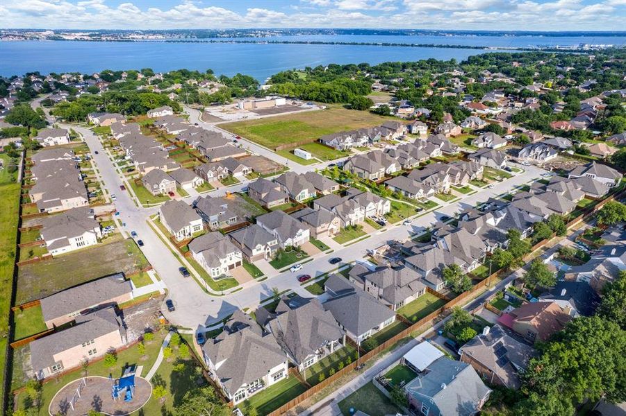 Neighborhood by the Water - This bird’s-eye view showcases the community’s walkability, modern architecture, and easy access to the lake and surrounding amenities. Neighborhood by the Water - This bird’s-eye view showcases the community’s walkability, modern architecture, and easy access to the lake and surrounding amenities.