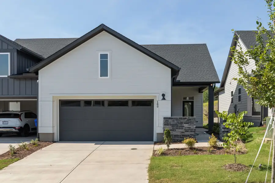 Front exterior of a new home in Encore at Chatham Park – Villa Series, Pittsboro, NC, highlighting curb appeal (Image 2). Front exterior of a new home in Encore at Chatham Park – Villa Series, Pittsboro, NC, highlighting curb appeal (Image 2).