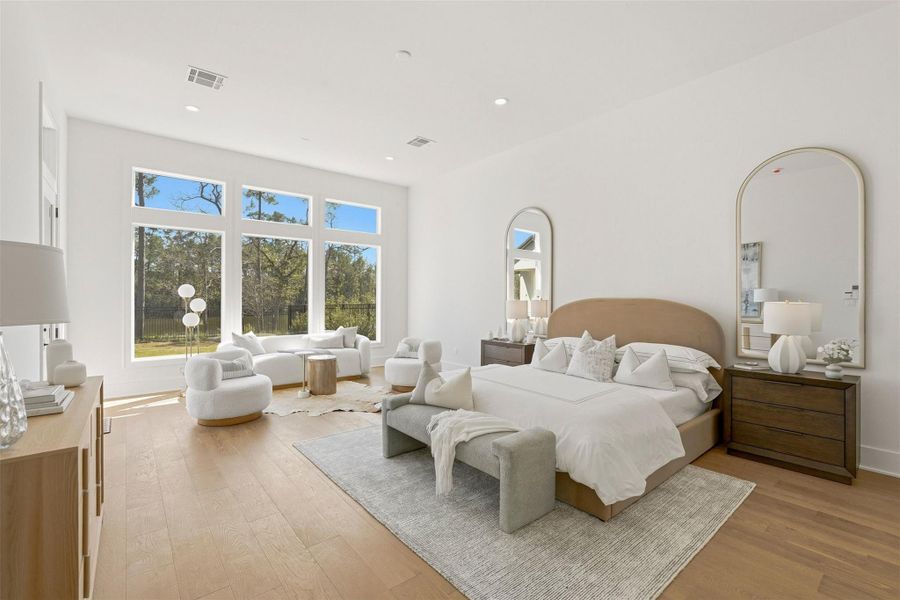 Tucked away at the end of the back hallway, your serene and secluded primary suite where abundant windows frame tranquil, private lake views. The suite is generously proportioned offering space for a comfortable seating area and a peaceful retreat. Tucked away at the end of the back hallway, your serene and secluded primary suite where abundant windows frame tranquil, private lake views. The suite is generously proportioned offering space for a comfortable seating area and a peaceful retreat.