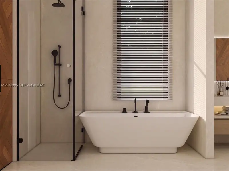 Bright bathroom featuring glass-enclosed shower, freestanding tub, and natural light.