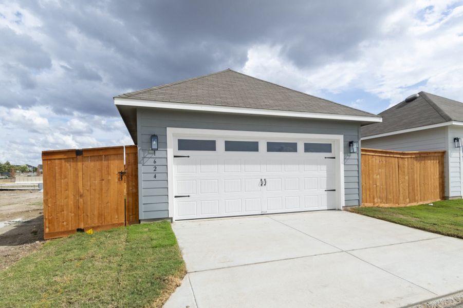 Front exterior of a new home in Trace, San Marcos, TX, highlighting curb appeal (Image 29).
