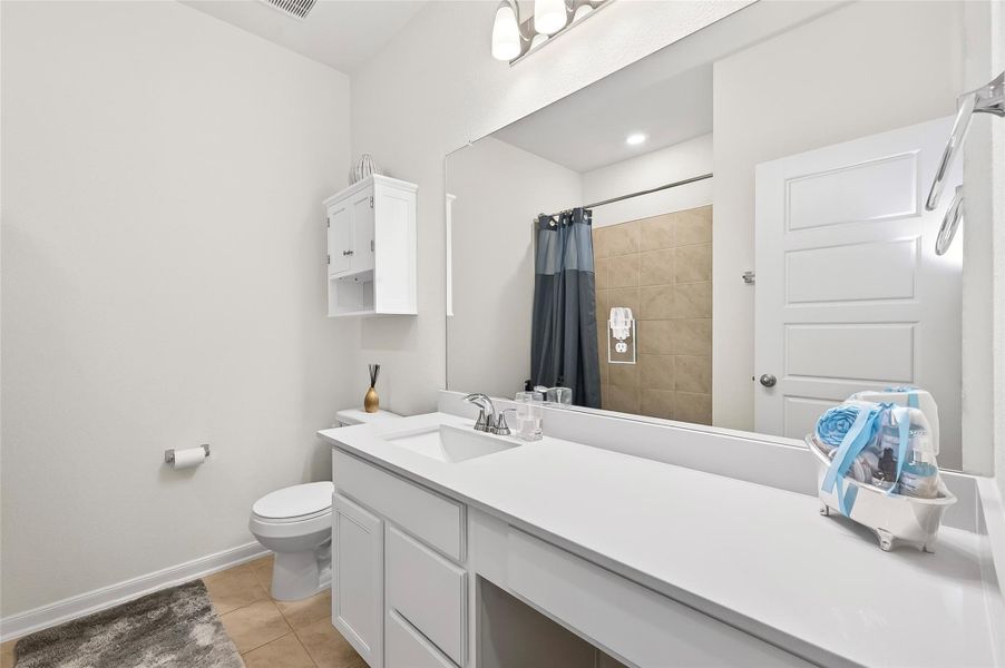 Secondary bathroom features plenty of counterspace!