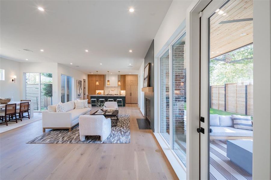 Living room featuring plenty of natural light and light wood-type flooring