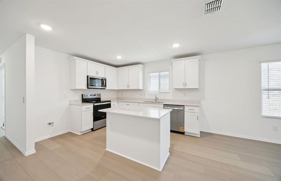 Spacious kitchen with eat-in bartop island