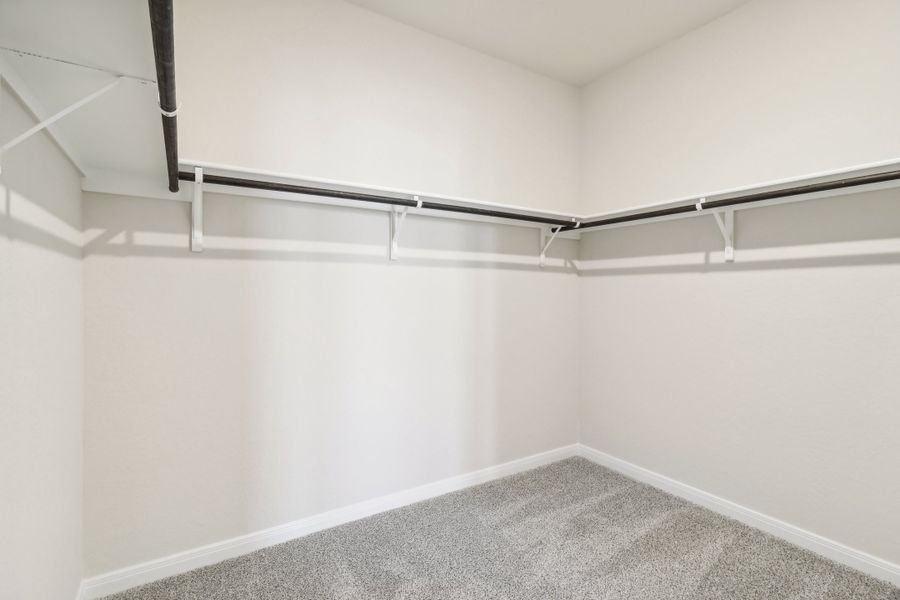 Primary suite walk-in closet in the Briscoe floorplan at a Meritage Homes community.