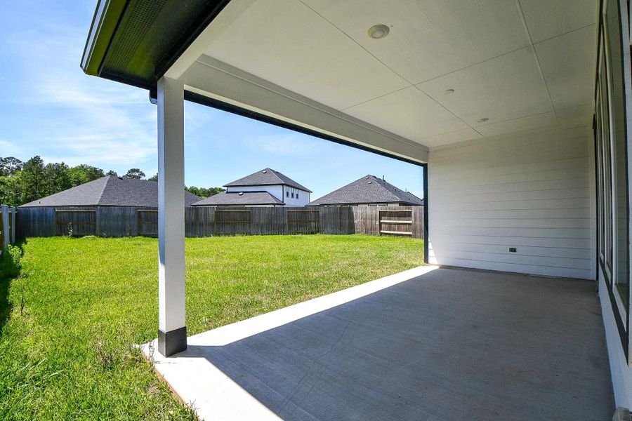 Exterior details and patio area of a home in Hills of Westlake, Conroe (Image 4). Exterior details and patio area of a home in Hills of Westlake, Conroe (Image 4).