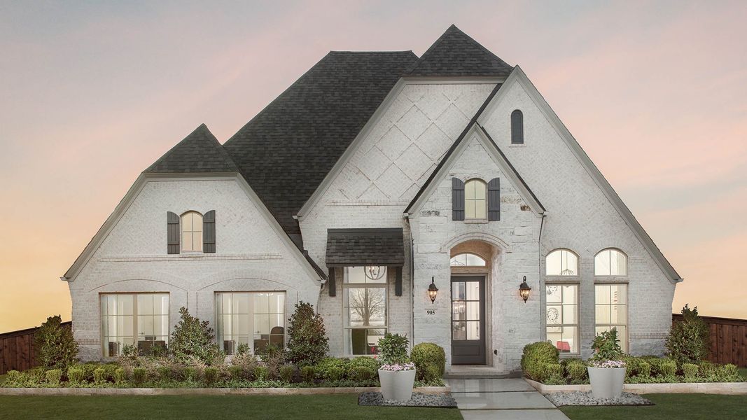 Front exterior of a new home in Trinity Falls, McKinney, TX, highlighting curb appeal (Image 2).