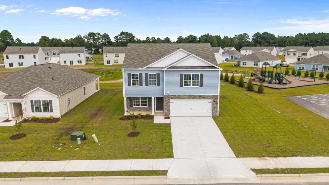 Front exterior of a new home in Madeline Farm, New Bern, NC, highlighting curb appeal (Image 13).