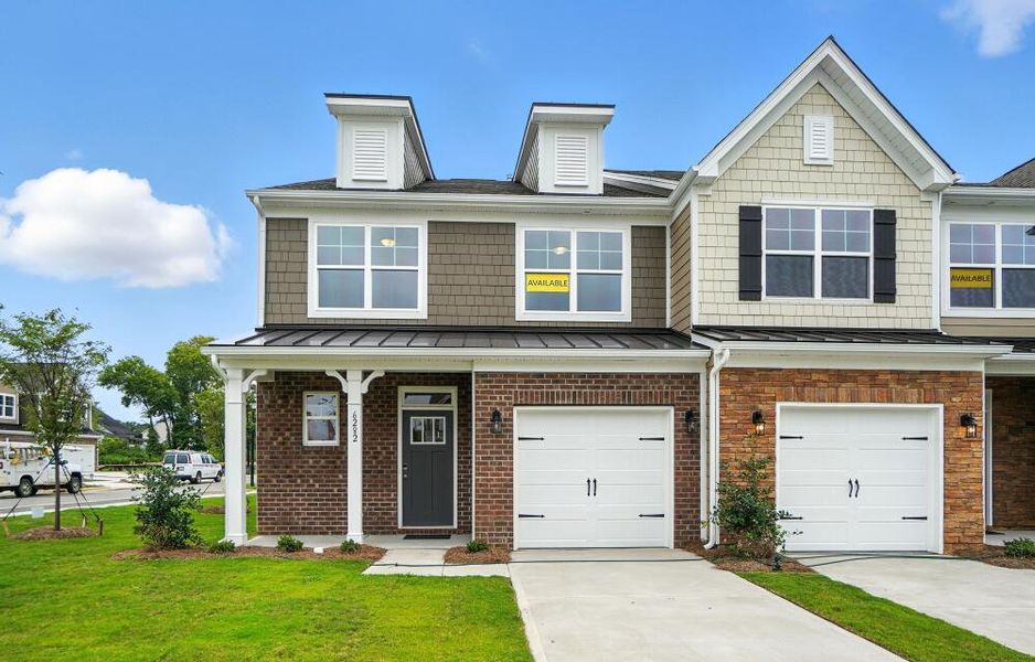 Front exterior of a new home in Harrisburg Village Townhomes, Harrisburg, NC, highlighting curb appeal (Image 2). Front exterior of a new home in Harrisburg Village Townhomes, Harrisburg, NC, highlighting curb appeal (Image 2).