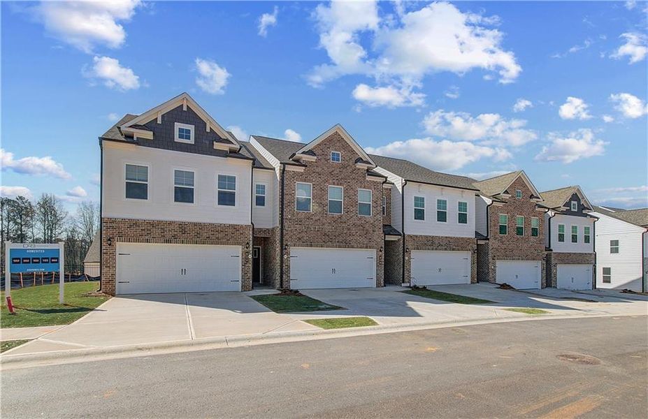 Front exterior of a new home in Auburn Ridge, Riverdale, GA, highlighting curb appeal (Image 23). Front exterior of a new home in Auburn Ridge, Riverdale, GA, highlighting curb appeal (Image 23).