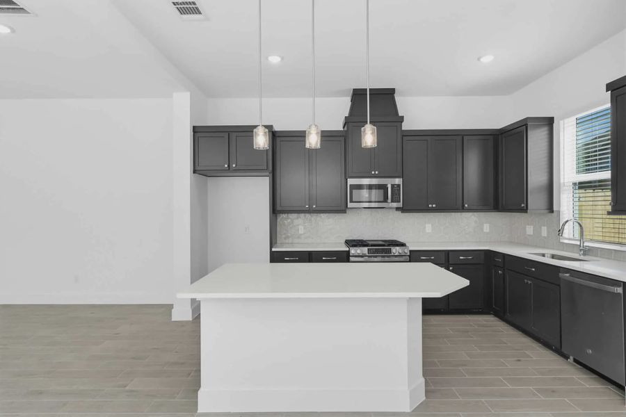 Representative furnished interior of a home built from the Chantilly 2 by Chesmar Homes in Sienna Chateau, Missouri City (Image 5).