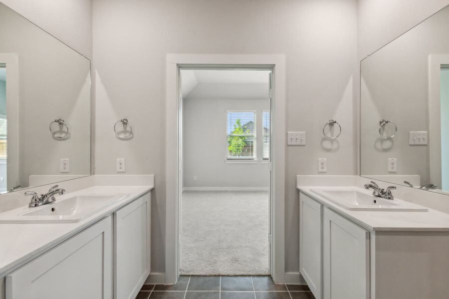 Primary Bathroom in the Cedar home plan by Trophy Signature Homes – REPRESENTATIVE PHOTO