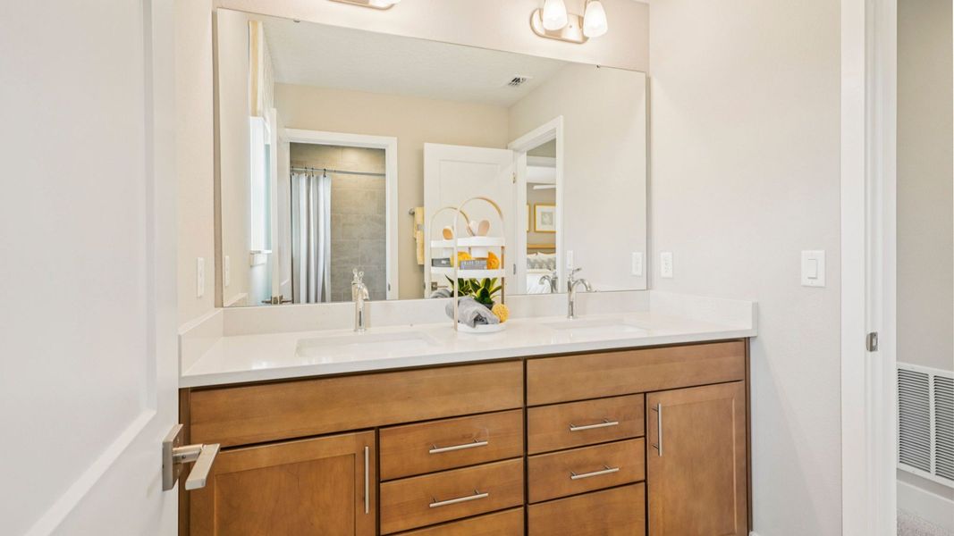 Representative furnished interior of a home built from the Sweetgum by DRB Homes in Ardisia Park, New Smyrna Beach (Image 52).