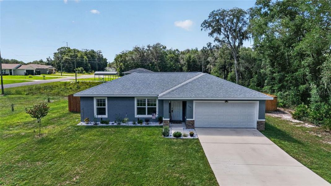 Front exterior of a new home in , Ocala, FL, highlighting curb appeal (Image 2). Front exterior of a new home in , Ocala, FL, highlighting curb appeal (Image 2).