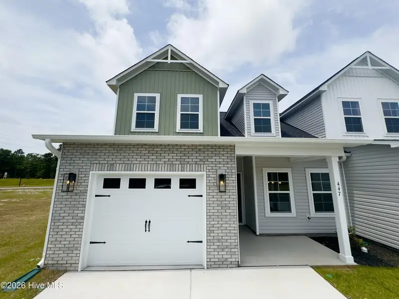 Front exterior of a new home in Autumn Trail, Bolivia, NC, highlighting curb appeal (Image 1). Front exterior of a new home in Autumn Trail, Bolivia, NC, highlighting curb appeal (Image 1).