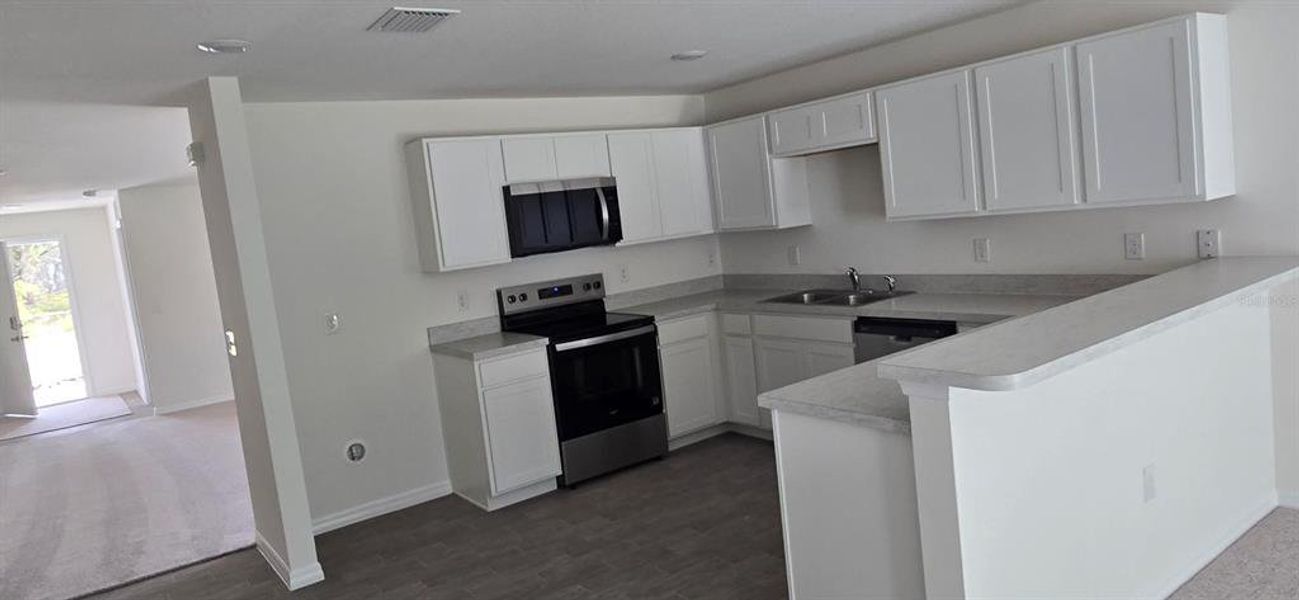 Furnished interior view inside a new home in , Poinciana (Image 5). Furnished interior view inside a new home in , Poinciana (Image 5).