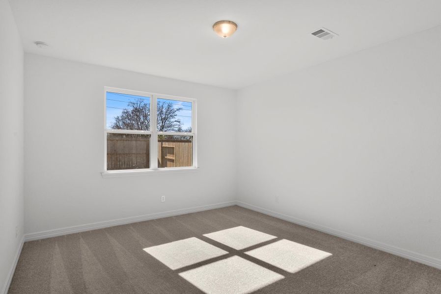 Secondary upstairs bedroom.