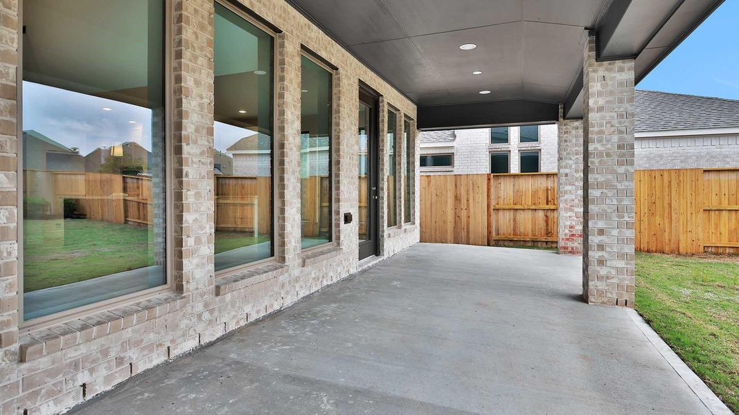 Exterior details and patio area of a home in Meridiana, Manvel (Image 3).