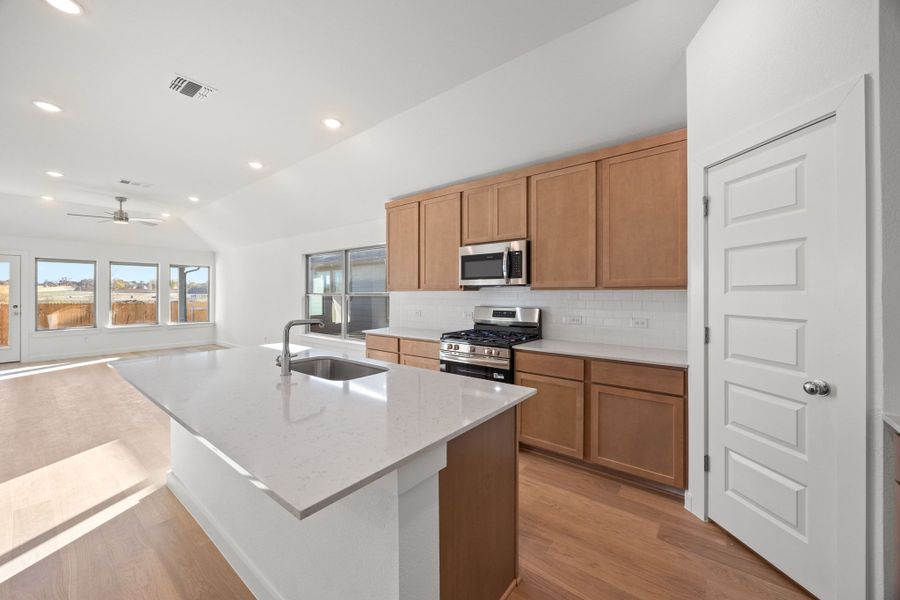 Kitchen in the Turquoise home plan by Trophy Signature Homes – REPRESENTATIVE PHOTO