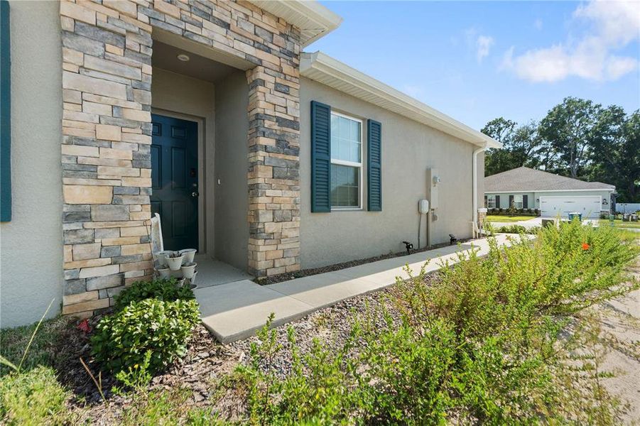 Front exterior of a new home in Park Ridge Villas, Spring Hill, FL, highlighting curb appeal (Image 2).