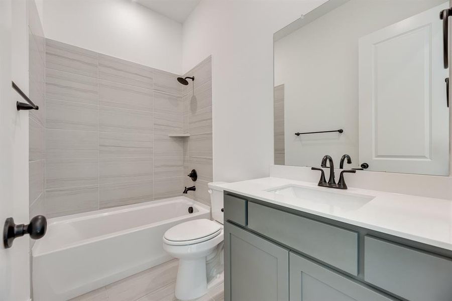 Full bath featuring bathtub / shower combination and vanity