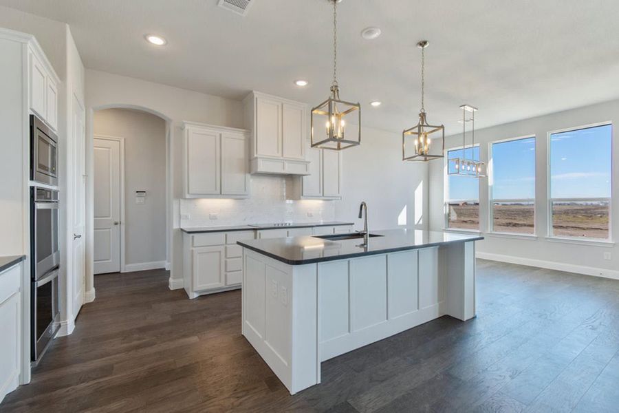 Kitchen to Nook | Concept 2406 at The Meadows in Gunter, TX by Landsea Homes