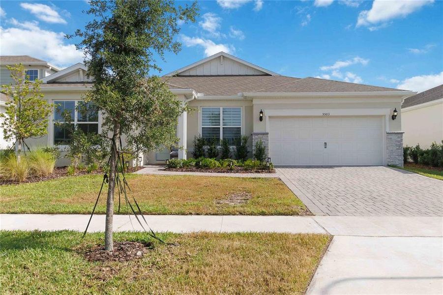 Front exterior of a new home in Bridgewalk, St. Cloud, FL, highlighting curb appeal (Image 2). Front exterior of a new home in Bridgewalk, St. Cloud, FL, highlighting curb appeal (Image 2).