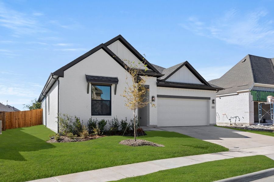 Front exterior of a new home in West Crossing, Anna, TX, highlighting curb appeal (Image 2).