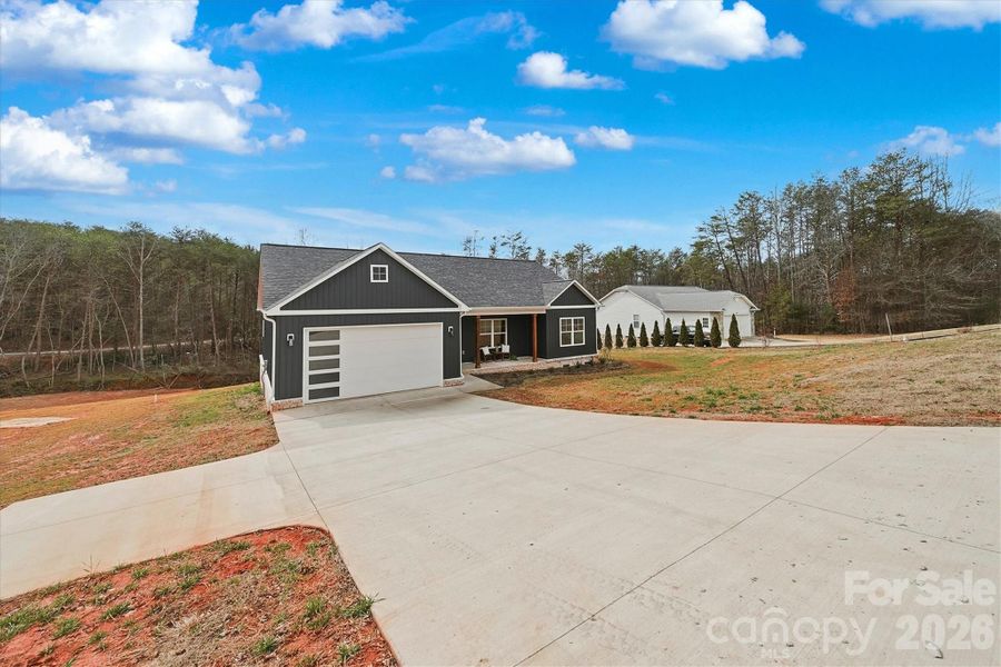 Front exterior of a new home in , Taylorsville, NC, highlighting curb appeal (Image 25).
