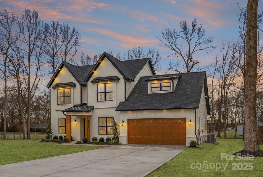 Front exterior of a new home in , Indian Trail, NC, highlighting curb appeal (Image 25).
