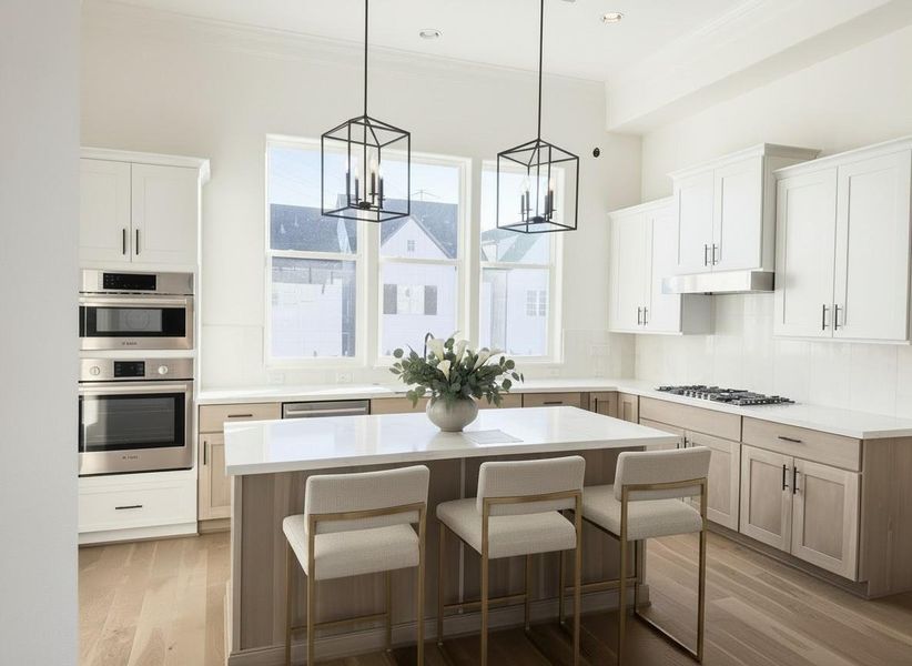 beautiful white oak finishes in this bright open kitchen with soaring 12ft ceilings and SS luxe Bosch appliances and white marble slab backsplash