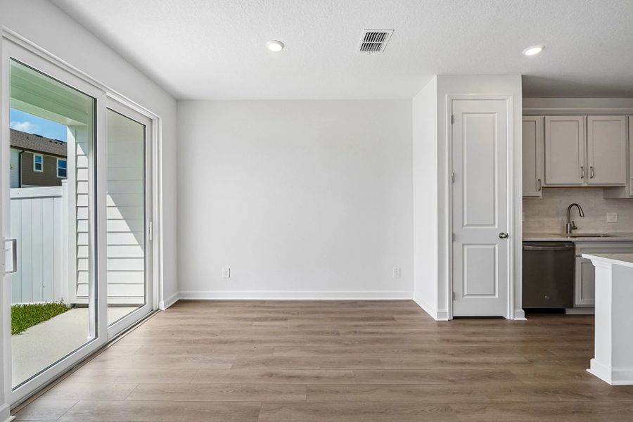 Off the kitchen is the dining room space