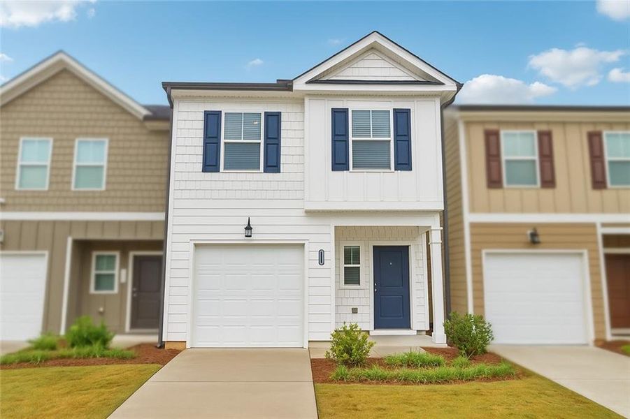 Front exterior of a new home in Cambridge at Towne Center, Hoschton, GA, highlighting curb appeal (Image 1).