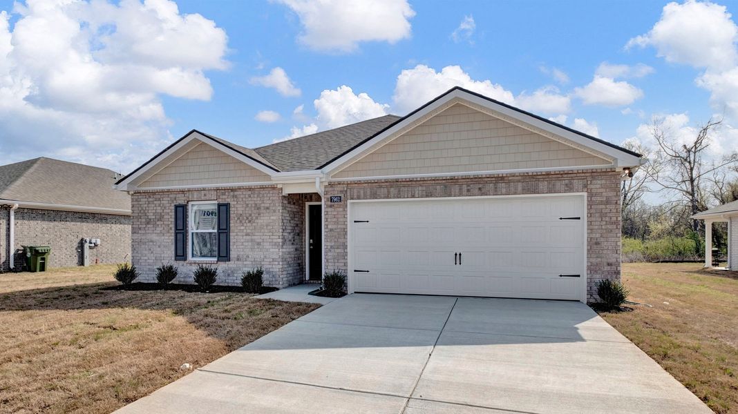 Front exterior of a new home in Huntington Estates, Millington, TN, highlighting curb appeal (Image 2).