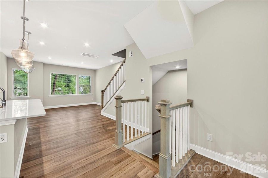 Second floor landing with open rail stairs Second floor landing with open rail stairs