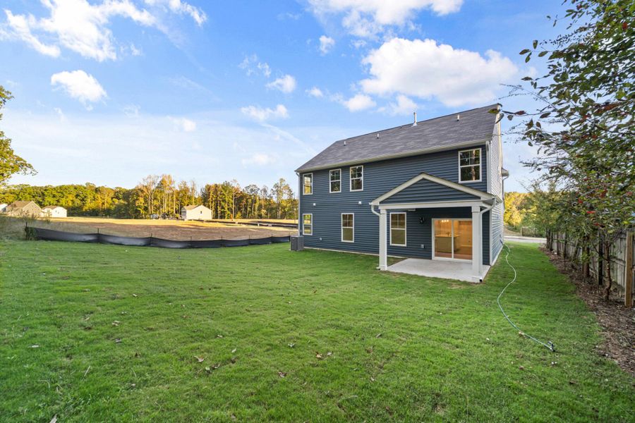 Exterior details and patio area of a home in Chandler Ridge, McLeansville (Image 4).