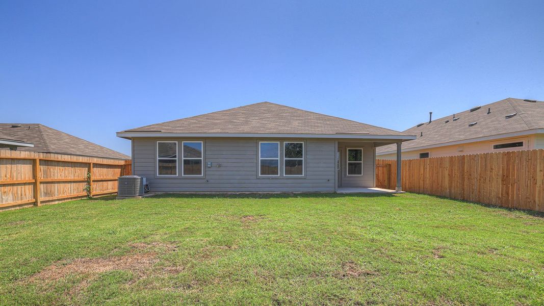Front exterior of a new home in Navarro Fields, Seguin, TX, highlighting curb appeal (Image 21). Front exterior of a new home in Navarro Fields, Seguin, TX, highlighting curb appeal (Image 21).