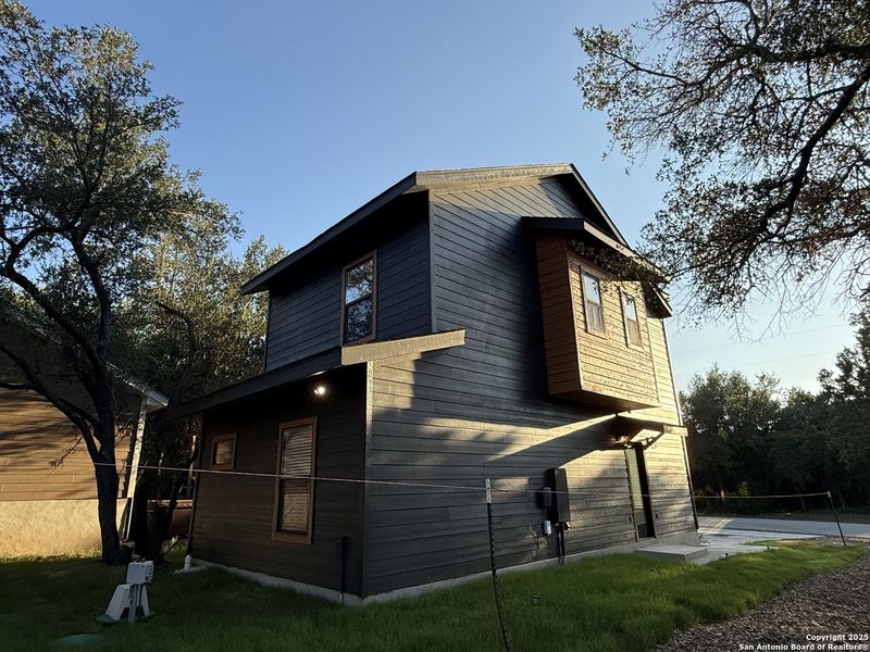 Front exterior of a new home in , Canyon Lake, TX, highlighting curb appeal (Image 13).