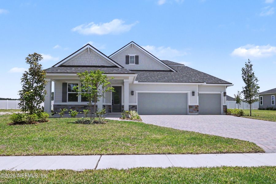 Front exterior of a new home in Brookestone, St. Augustine, FL, highlighting curb appeal (Image 2). Front exterior of a new home in Brookestone, St. Augustine, FL, highlighting curb appeal (Image 2).